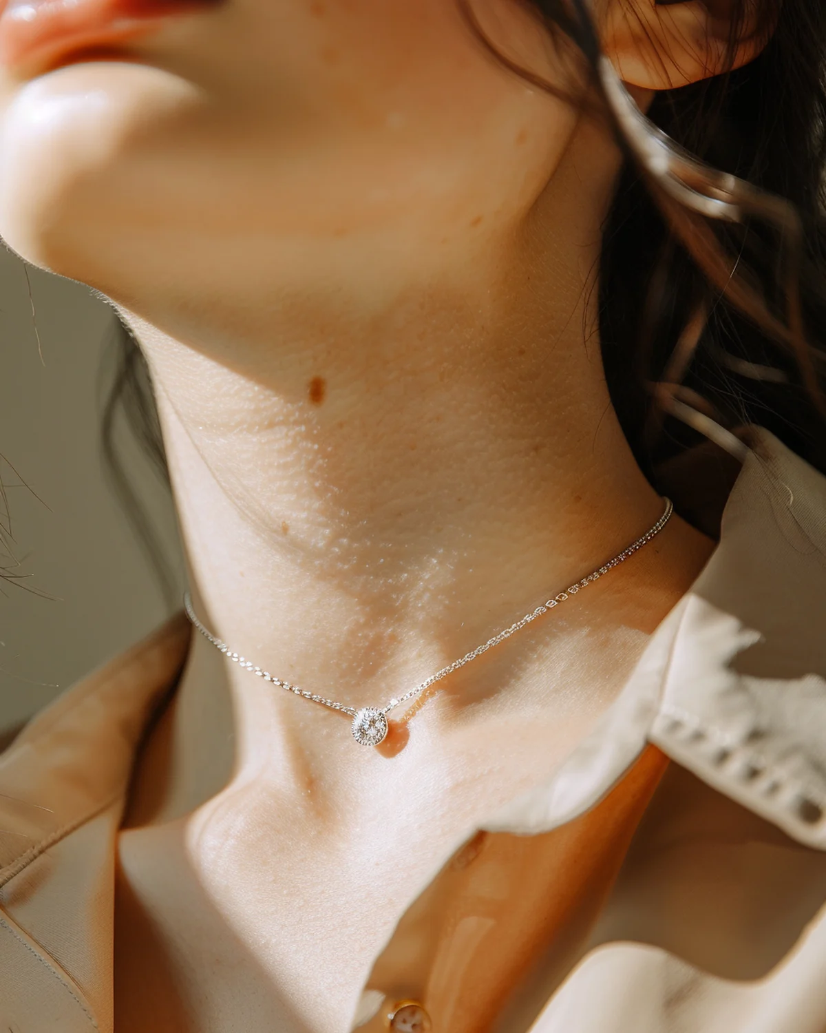 Lab-created moissanite East-West marquise necklace worn on the collarbone