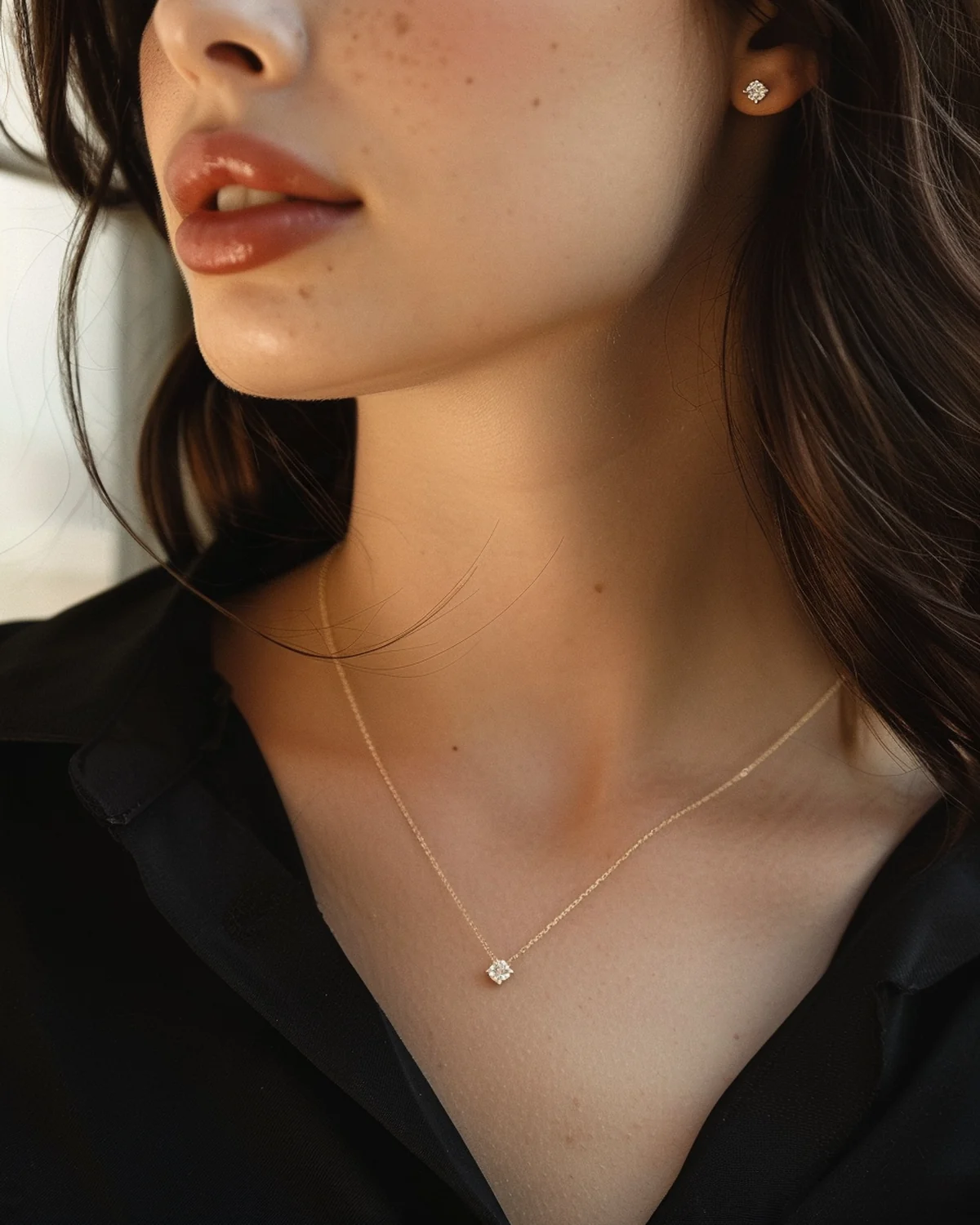 Pear and oval lab-created moissanite Toi et Moi necklace worn on the collarbone
